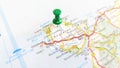 A green pin stuck in the island of Anglesey on a map Royalty Free Stock Photo