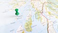 A green pin stuck in the island of colonsay on a map of Scotland Royalty Free Stock Photo