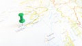 A green pin stuck in the island of Iona on a map of Scotland Royalty Free Stock Photo