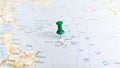 A green pin stuck in the island of skyros skiros on a map of Greece Royalty Free Stock Photo