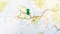 A green pin stuck in the island of sky on a map of Scotland