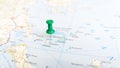 A green pin stuck in the Vories sporades islands on a map of Greece Royalty Free Stock Photo