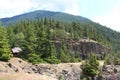 Green pines on hill and wood house, Diablo Lake and Mountain landscape view, North Cascades National Park, Washington state, USA Royalty Free Stock Photo