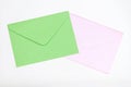 Green and pink envelopes on pastel background