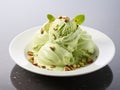 Green pistachio ice cream with nuts in white ceramic plate Royalty Free Stock Photo