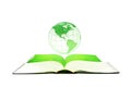 Green planet earth globe floating over opened book isolated on white background.