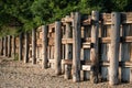 Totem tiki gate fence on beach side with sandy ground