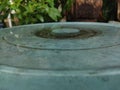 green plastic basin covered with rainwater Royalty Free Stock Photo