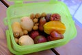 Green Plastic container box full with fresh ripe tropical fruits for transportarion