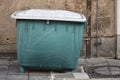 Green plastic dumpster at old abandoned Tempelhofer Feld in Tempelhof Berlin Germany Royalty Free Stock Photo