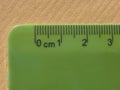 green plastic metric ruler