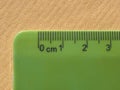 green plastic metric ruler