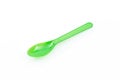 Green plastic spoon isolated on white background Royalty Free Stock Photo