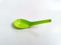 Green plastic spoon isolated on white background Royalty Free Stock Photo