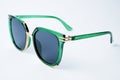 Green plastic sun glasses with polarization lens Royalty Free Stock Photo