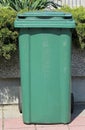 Green plastic trash can Royalty Free Stock Photo