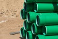 Green plastic tubes on a construction site Royalty Free Stock Photo