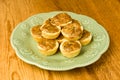 Green plate of pecan tassie cookies Royalty Free Stock Photo