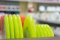 Green plates on the shelf in the store