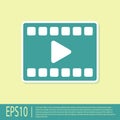 Green Play Video icon isolated on yellow background. Film strip with play sign. Vector