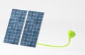 Green plug with two solar panels, green energy concept, energy transition, renewable electricity Royalty Free Stock Photo