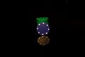 Green pocker chips stack with a blue chip in front isolated on black with reflection Royalty Free Stock Photo