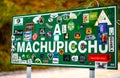 Green pointing sign to Machupicchu