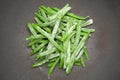 Green pole beans frozen in a wok, close up