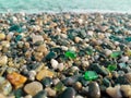 Green polished sea glass stones clam vacation holiday vacation sea shore background