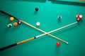 Green pool billiards table with balls and cue Royalty Free Stock Photo