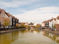 Green pool lake in front of houses marina