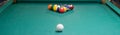 Green pool table, pyramid of balls to play, white ball to hit. Royalty Free Stock Photo