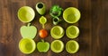 Green porcelain dishes top view with an orange plastic funnel