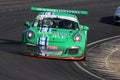 Green Porsche 991 racecar in action