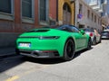 green porsche targa 911 4 gts coupe roadster sportcar german parked in the street