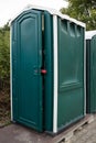 Portable plastic toilet on construction site