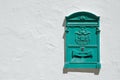 Green postbox.