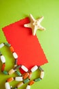 Green postcard with beads and shells Royalty Free Stock Photo