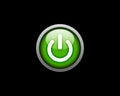 Green Power button on black background Royalty Free Stock Photo