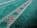 Green prayer mat on the mosque