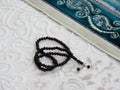 Green prayer rug and rosary. green prayer rug and ramadan month