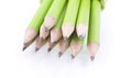 Green prepared pencils on white isolated background