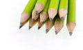 Green prepared pencils on white isolated background