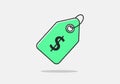 A green price tag with a black dollar sign is centrally displayed against a plain white background. Royalty Free Stock Photo