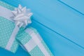 Green printed gift boxes with white ribbon. Royalty Free Stock Photo