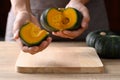 Green pumpkin or Japanese pumpkin in woman hand prepare for cooking