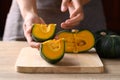 Green pumpkin or Japanese pumpkin in woman hand prepare for cooking