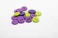 Green and purple buttons in a pile Royalty Free Stock Photo