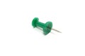 green push pin on white background