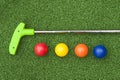 Green Putt Putt Club with Balls Royalty Free Stock Photo